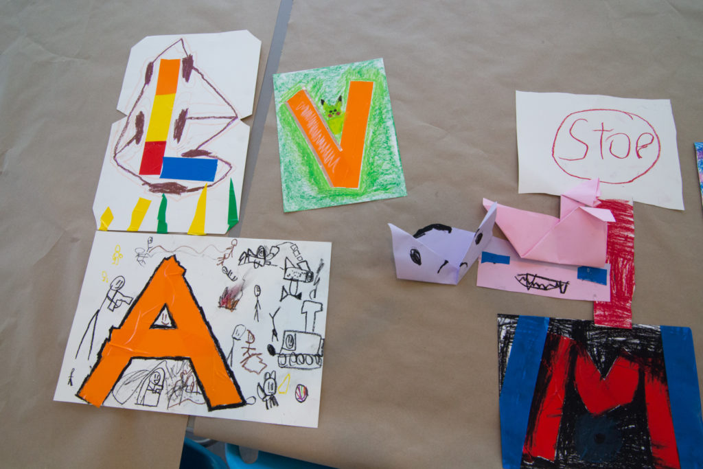 photo of kid's art crafts, initials on paper