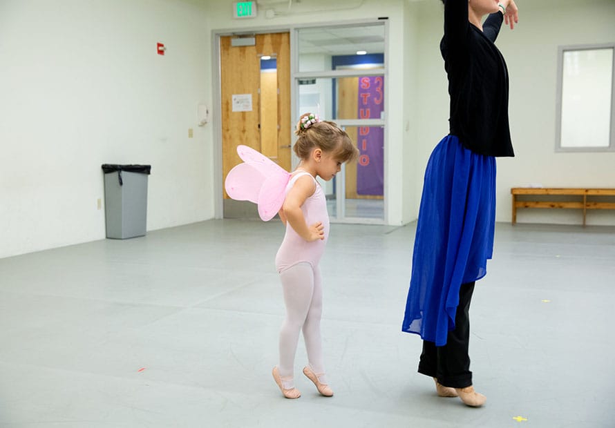 Little Girl Dancing Behind Instructor